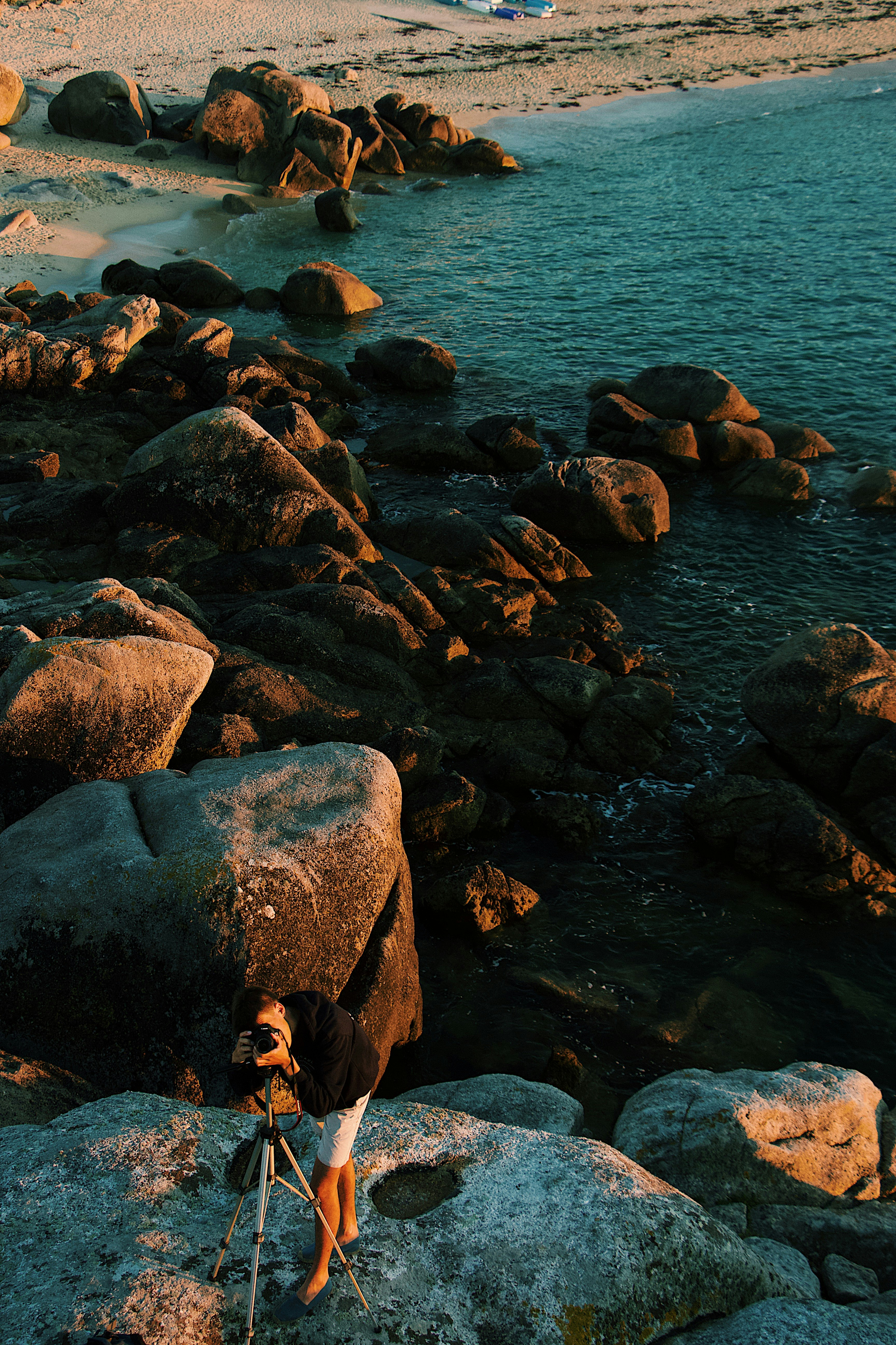 man standing on rock